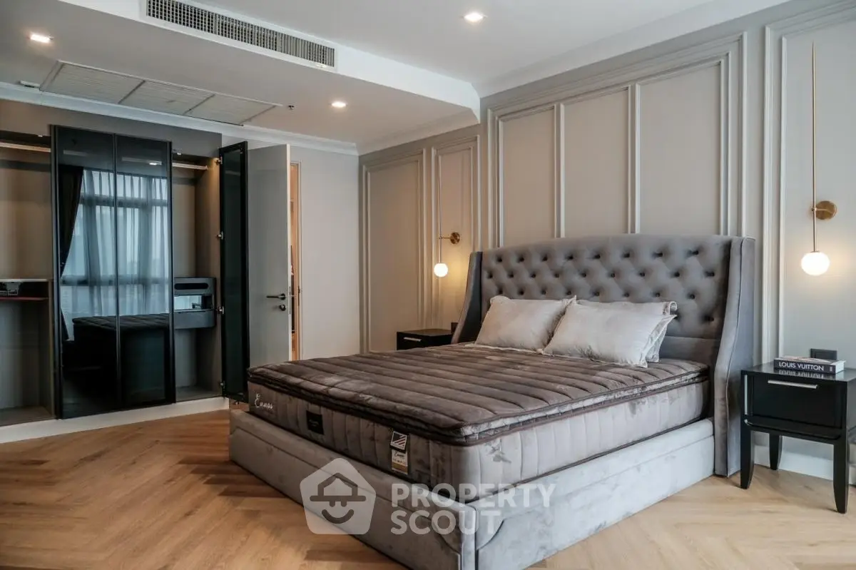 Luxurious bedroom with plush bed and elegant decor, featuring a walk-in closet.