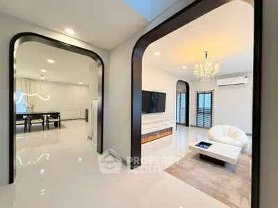 Luxurious modern living room with elegant chandelier and sleek design