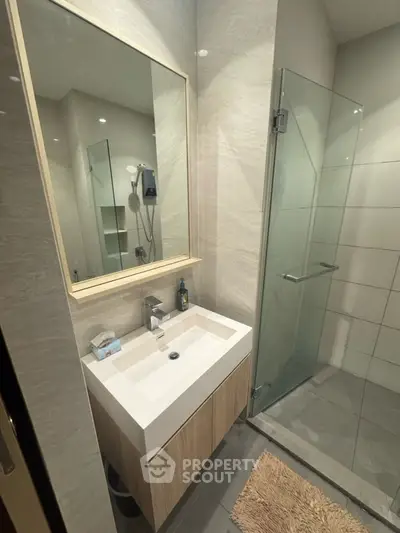 Modern bathroom with sleek glass shower and stylish vanity