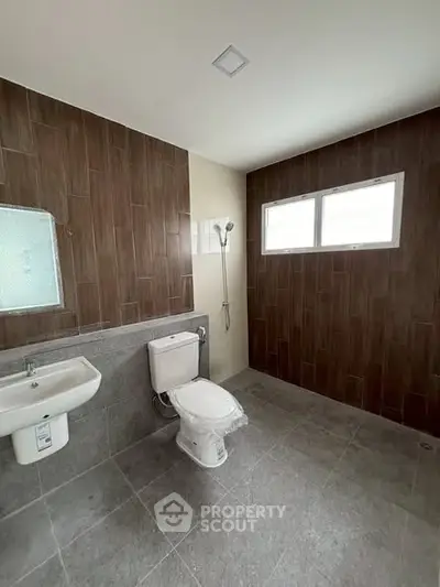 Modern bathroom with sleek tile design and natural light