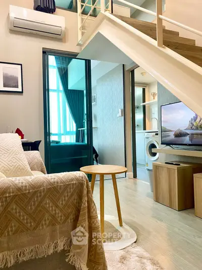 Modern duplex living room with stylish decor and natural light
