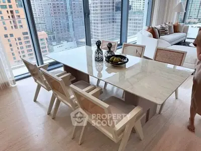Luxurious modern dining area with city view, elegant marble table, and stylish chairs.