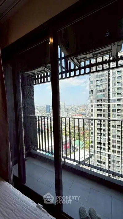 Stunning high-rise balcony view with cityscape panorama, perfect for urban living enthusiasts.