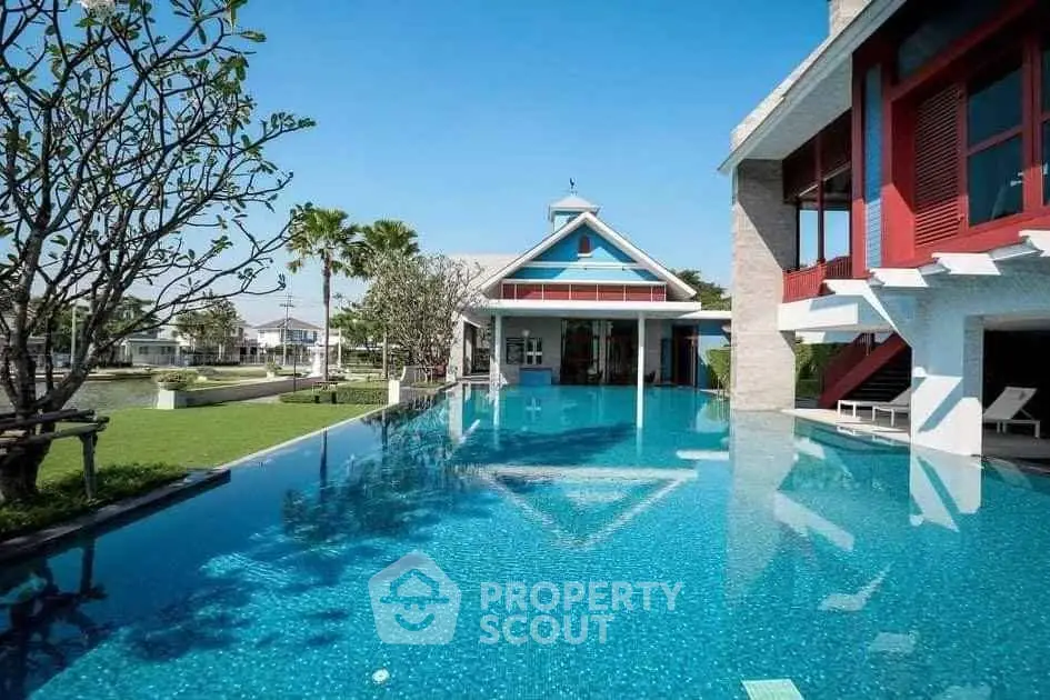 Luxurious villa with stunning pool and lush garden, perfect for relaxation and entertainment.