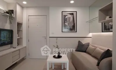 Modern living room with sleek design and cozy seating area