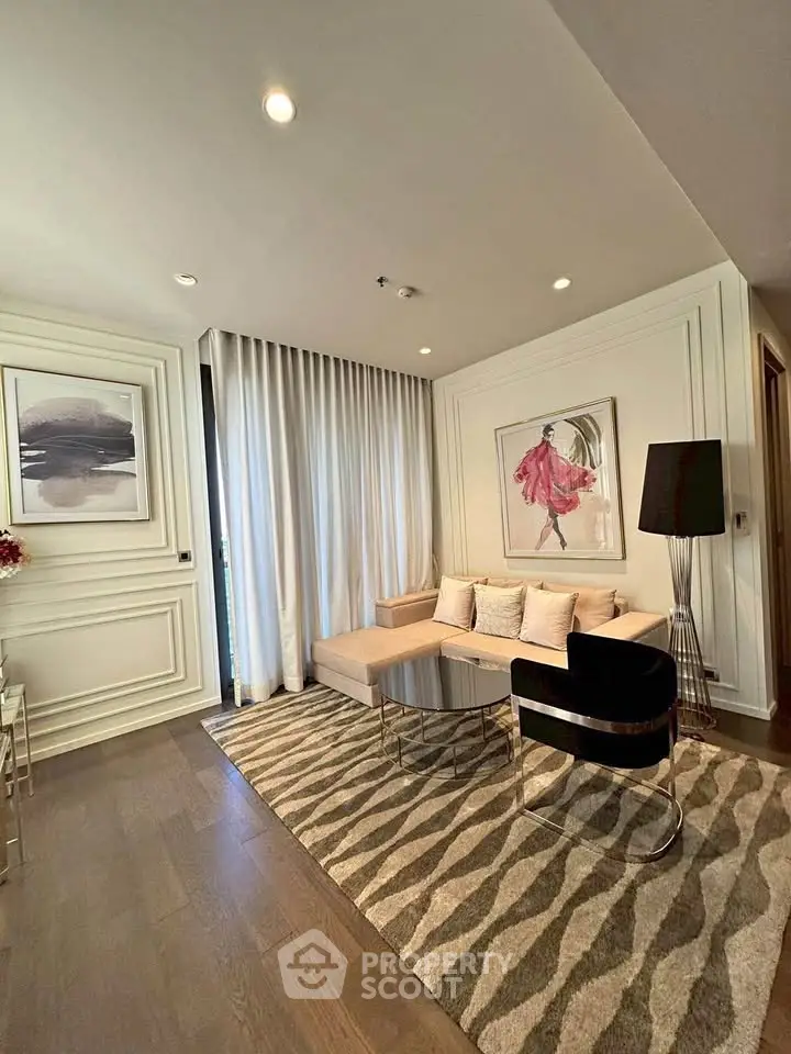 Elegant living room with modern decor, featuring a cozy sofa, stylish artwork, and chic lighting.