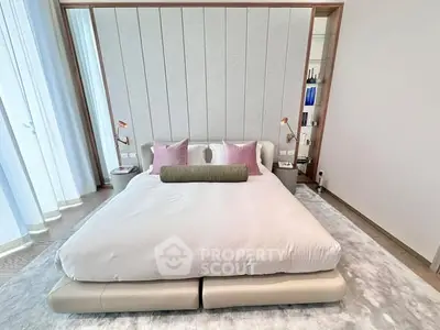 Luxurious modern bedroom with elegant decor and plush bedding