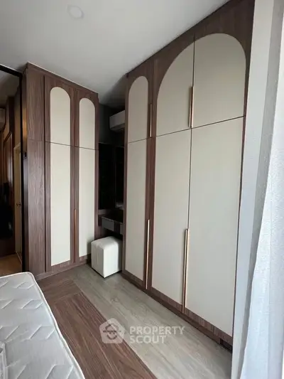 Stylish bedroom with modern built-in wardrobes and cozy ambiance