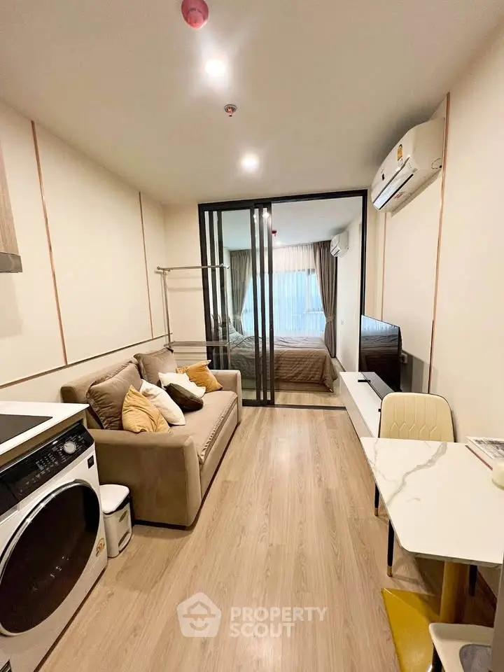 Modern studio apartment with cozy living area and bedroom separation