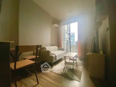 Cozy living room with modern decor and large window view