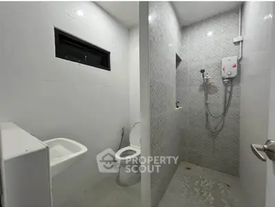Modern bathroom with shower and toilet in sleek design