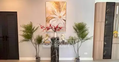 Elegant living room with modern decor and stylish wall art, perfect for contemporary home design.