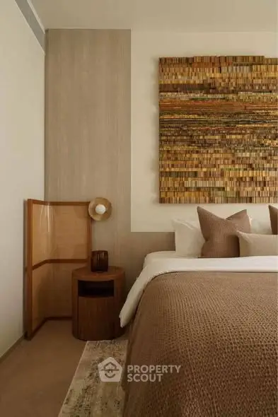 Elegant bedroom with earthy tones and textured wall art