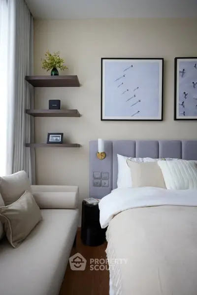 Stylish bedroom with modern decor and cozy seating area
