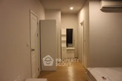 Modern bedroom with minimalist furniture and air conditioning unit
