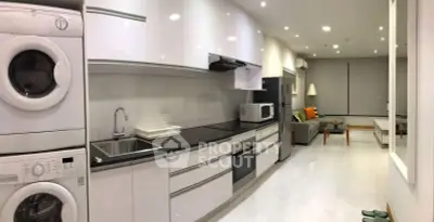 Modern kitchen with sleek appliances and open layout in a stylish apartment