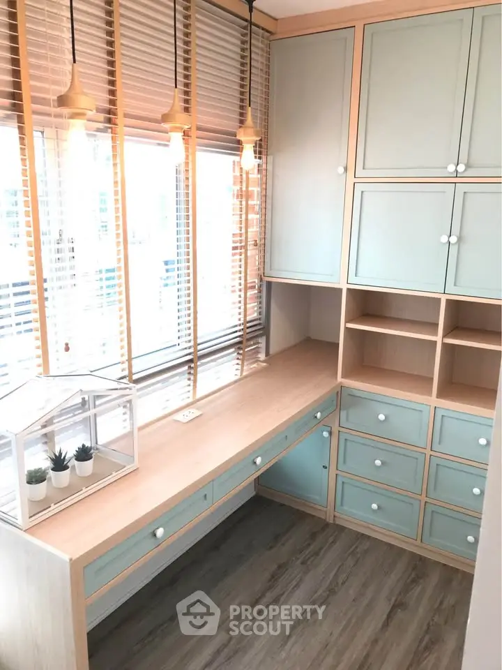 Charming study room with built-in cabinets and natural light