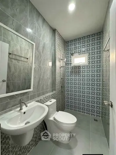 Modern bathroom with stylish tiles and sleek fixtures