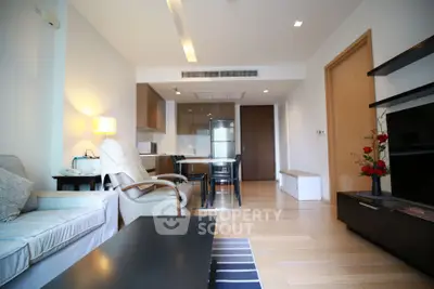 Spacious modern living room with open kitchen and stylish decor