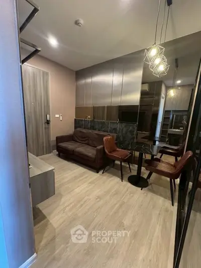 Modern living room with stylish furniture and elegant lighting in a contemporary apartment.
