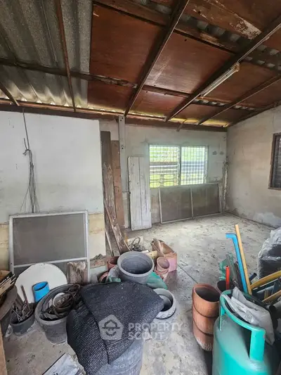 Spacious storage room with ample natural light and potential for customization.