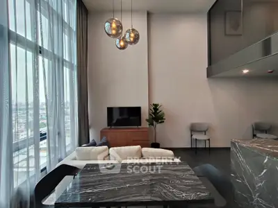 Modern living room with high ceilings and stylish decor