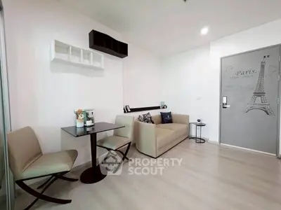 Chic modern living room with stylish decor and cozy seating in a contemporary apartment.