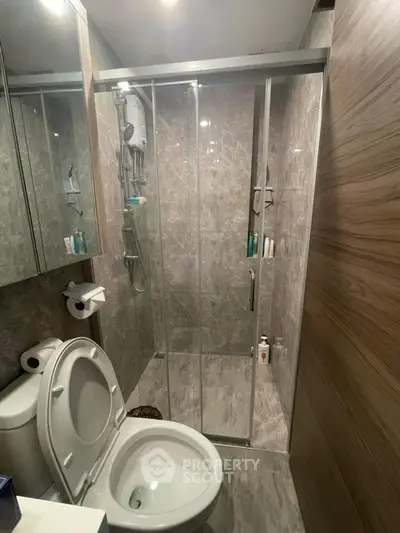 Modern bathroom with glass shower enclosure and sleek design