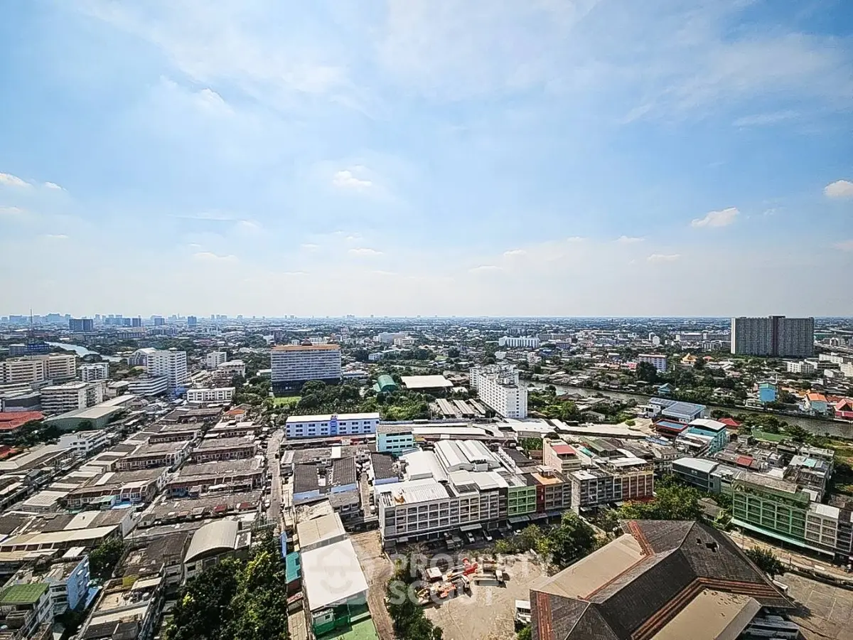 Stunning panoramic cityscape view from a high-rise building, showcasing urban skyline and vibrant city life.