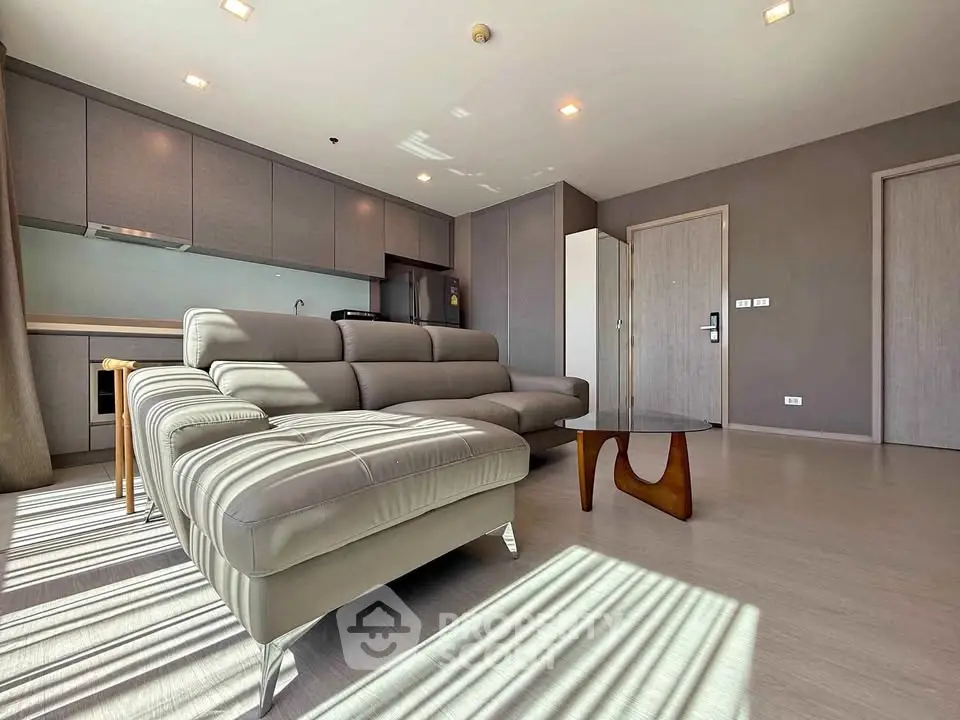 Spacious modern living room with sleek furniture and ample natural light