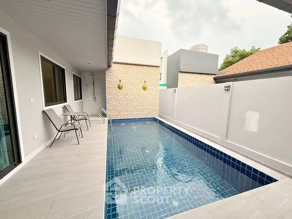 Modern private pool area with sleek design and comfortable seating, perfect for relaxation and entertainment.