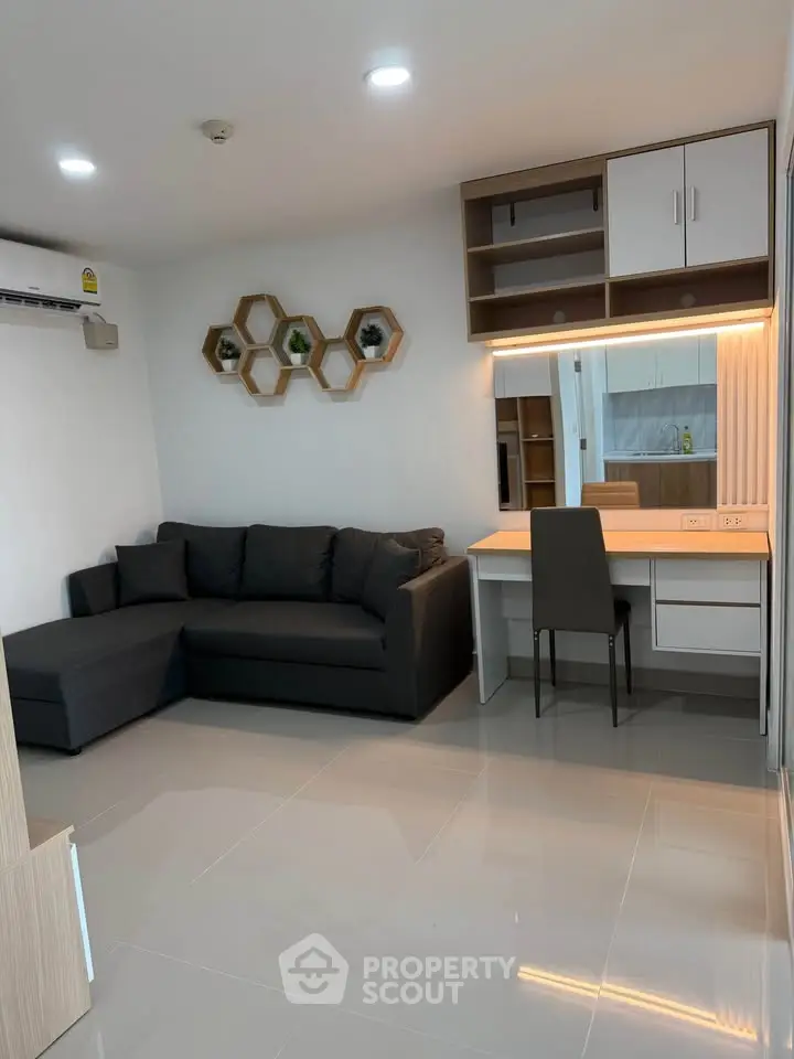 Modern living room with sleek furniture and stylish decor in a contemporary apartment.