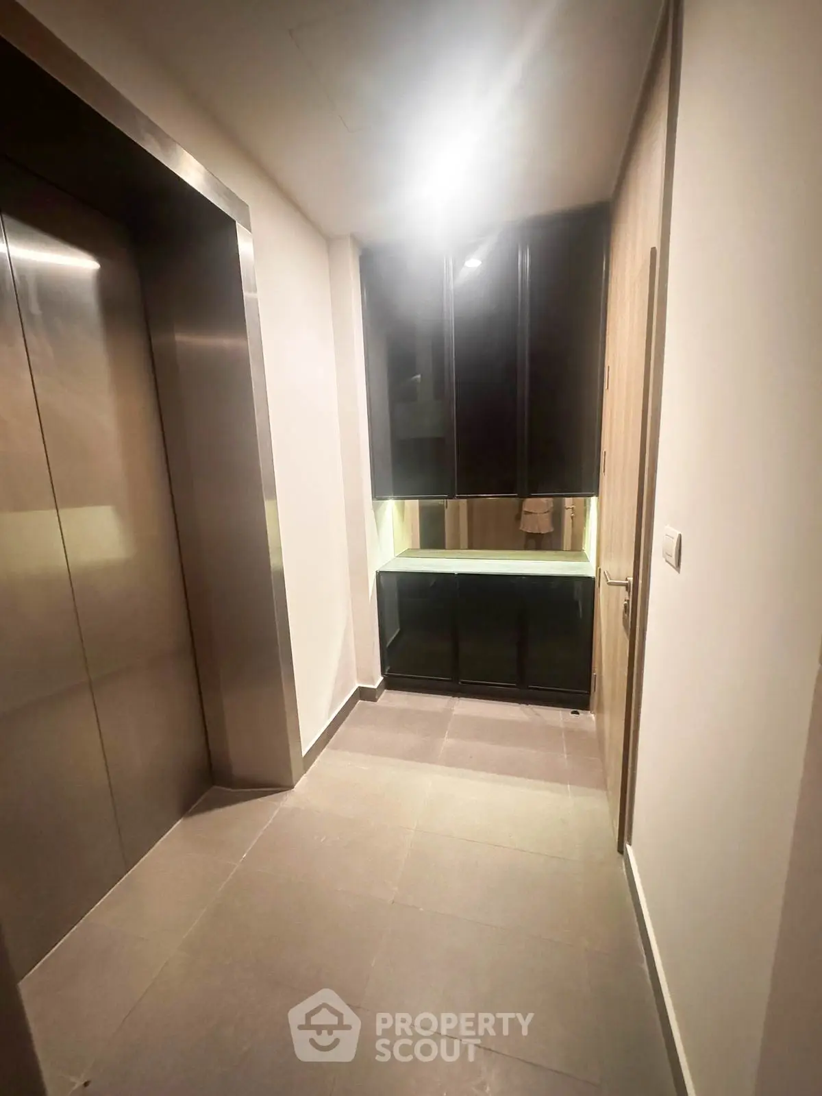 Modern elevator lobby with sleek design and ambient lighting