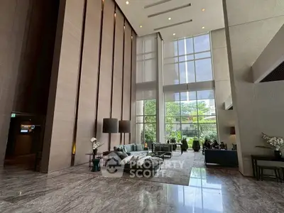 Luxurious high-ceiling living room with modern decor and large windows offering garden views.