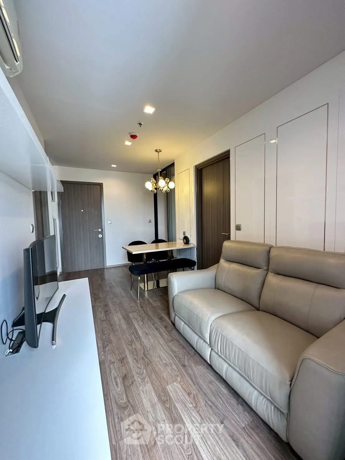 Modern living room with sleek furniture and open layout, perfect for urban living.