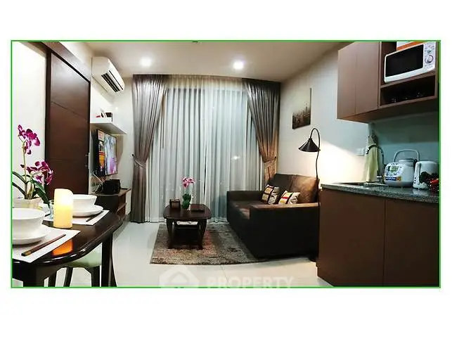 Modern living room with cozy seating and elegant decor in a stylish apartment.