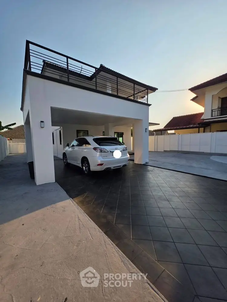 Modern two-story home with carport and sleek exterior design
