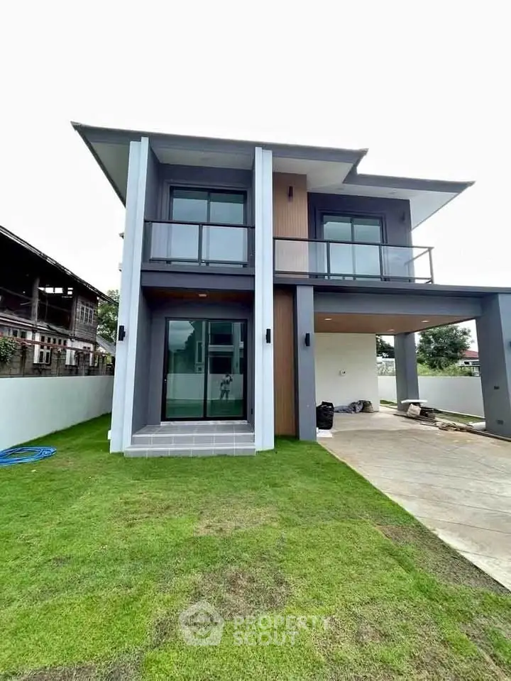 Modern two-story house with sleek design and spacious lawn