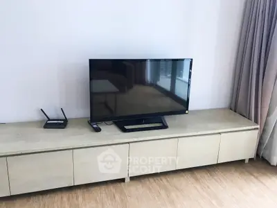 Modern living room with sleek TV setup and minimalist decor