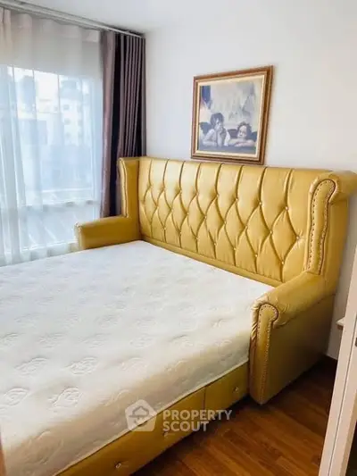 Cozy bedroom with elegant leather headboard and natural light