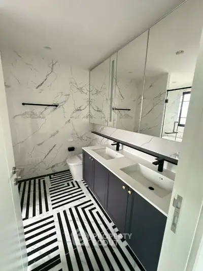 Luxurious bathroom with dual sinks and modern marble design