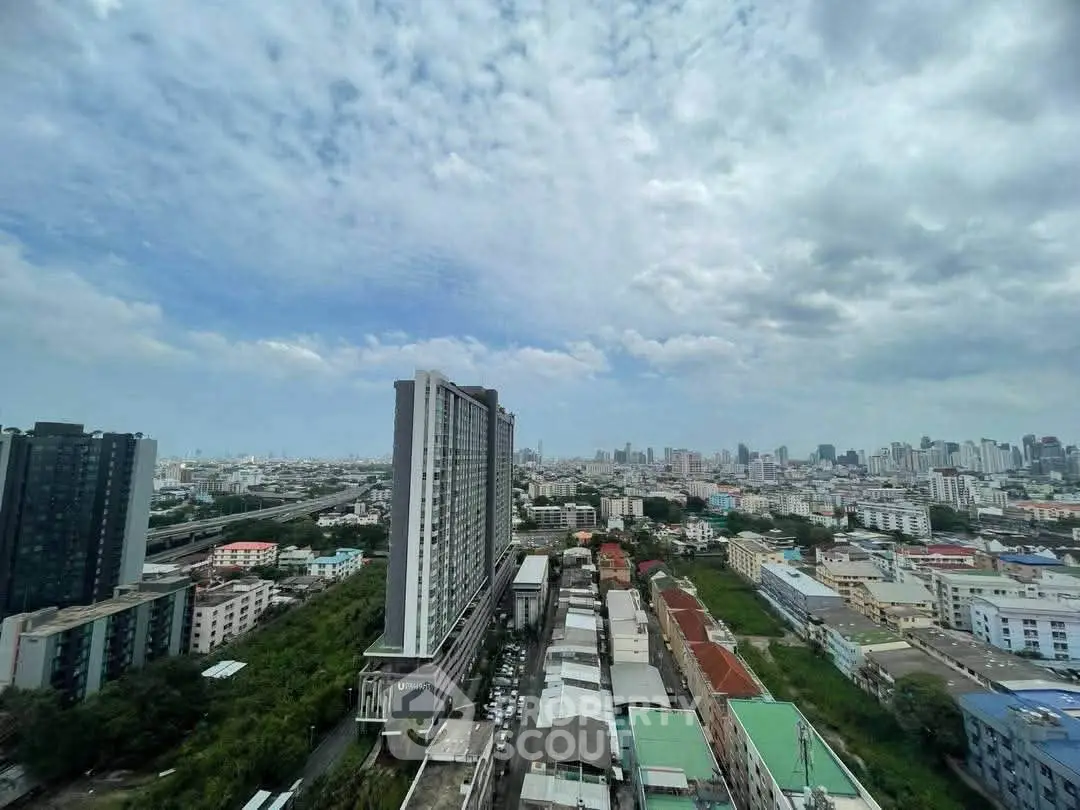 Stunning cityscape view from high-rise building showcasing urban skyline and vibrant neighborhood.