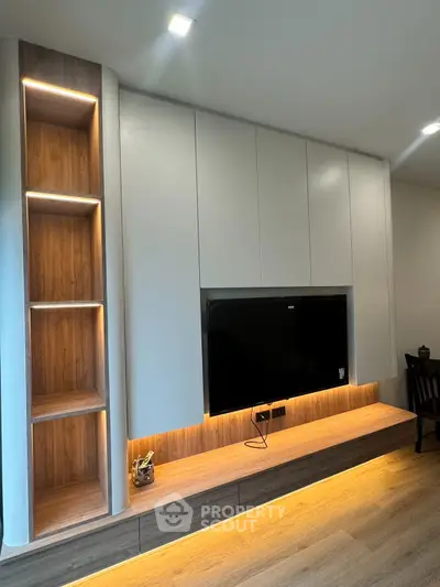 Modern living room with sleek TV unit and ambient lighting