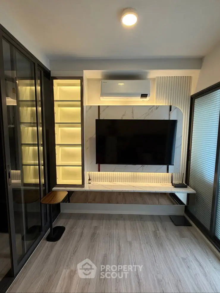 Modern living room with sleek TV setup and ambient lighting