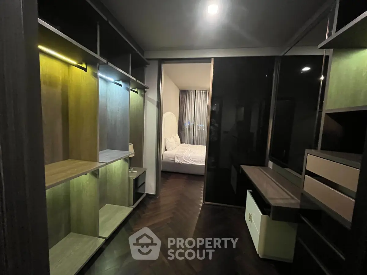 Modern bedroom with walk-in closet and sleek design