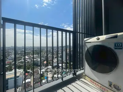 Stunning high-rise balcony view with cityscape and modern washing machine.