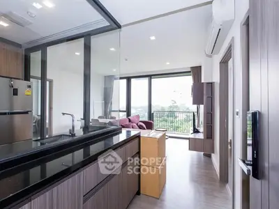 Modern open-layout apartment with spacious living area and balcony view.