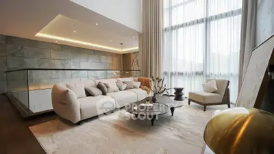 Luxurious modern living room with elegant furniture and large windows