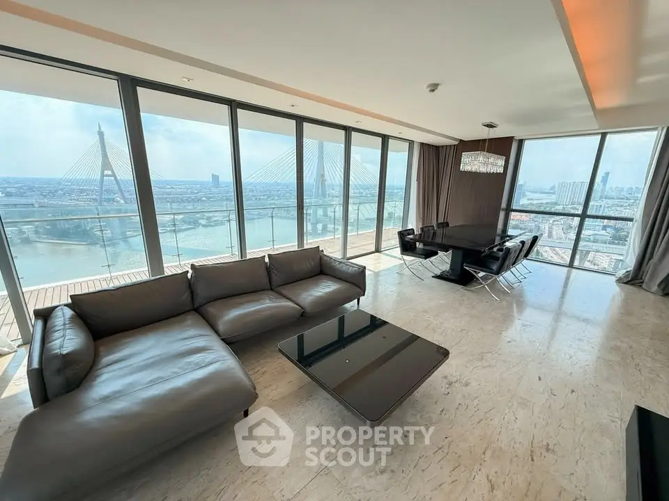Luxurious living room with panoramic city views and elegant furnishings.