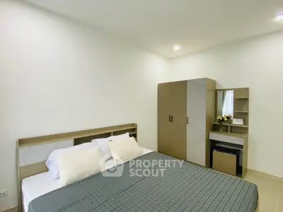 Modern bedroom with stylish furniture and cozy ambiance